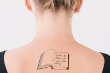 Book tattoo on the back