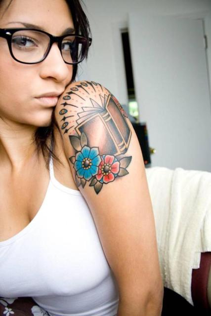 Book with flowers tattoo