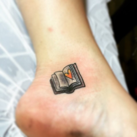 Book with orange heart on the ankle