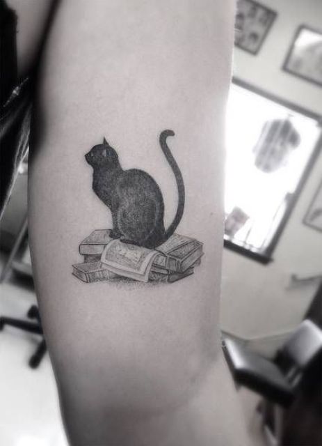Books and cat tattoo idea