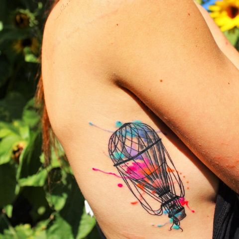 Colorful air balloon tattoo on the side
