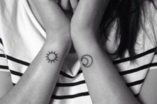 Combination of sun and half moon tattoos