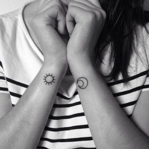 Combination of sun and half moon tattoos