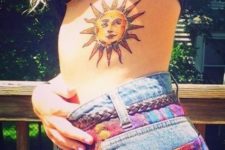 Eye-catching sun tattoo on the side