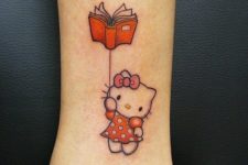 Hello Kitty with book tattoo