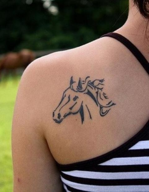 Horse head tattoo on the shoulder