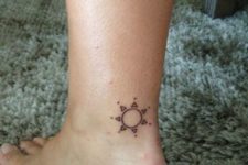 Minimalistic tattoo on the ankle