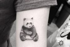 Panda tattoo on the arm