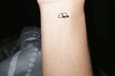 Tiny panda tattoo on the wrist