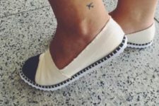 Tiny travel tattoo on the ankle
