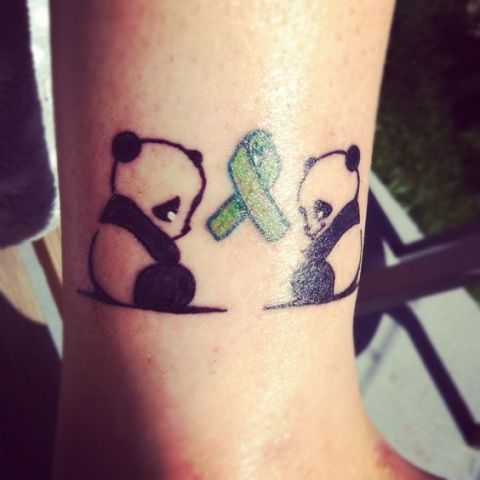Two panda bears tattoo on the ankle