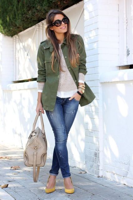 With beige shirt, green army jacket and skinny jeans