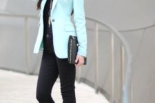 With black shirt and jeans, heels and clutch