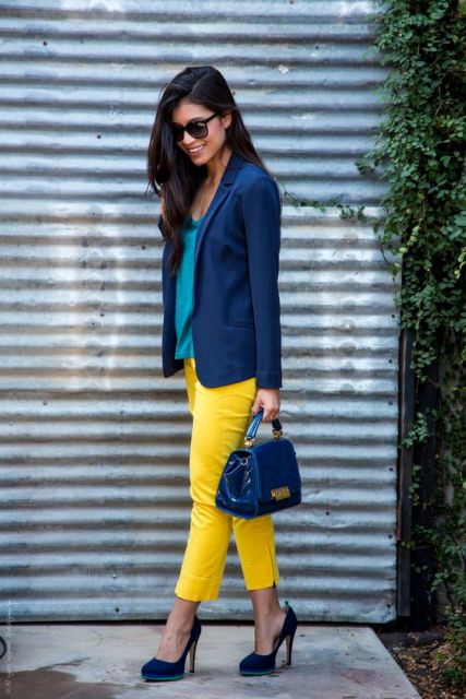 With blue jacket, bag and heels