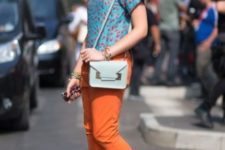 With blue printed shirt, neutral color heels and light blue bag