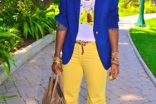 With bright blue jacket, white t-shirt and necklace