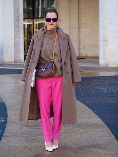 With coat, white shoes and small bag