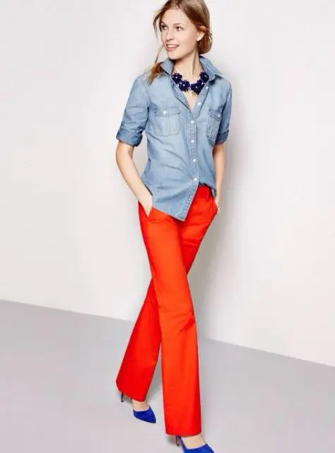 With denim shirt, statement necklace and blue shoes