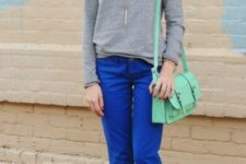 With gray sweatshirt, beige shoes and mint green bag