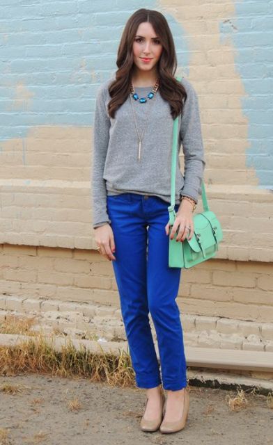 With gray sweatshirt, beige shoes and mint green bag
