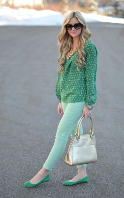 With green printed blouse, green flats and beige bag