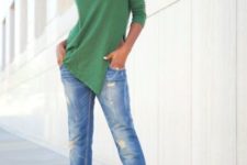 With green shirt and cuffed jeans