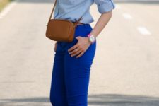 With light blue shirt, brown mini bag and fuchsia shoes