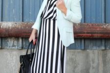 With maxi striped dress and black bag