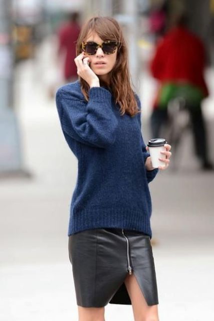 With navy blue sweater and printed sunglasses