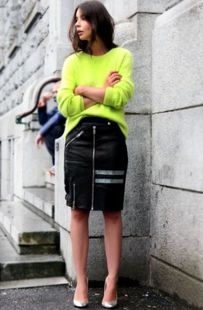 With neon sweater and metallic shoes