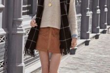 With neutral color sweater, plaid scarf and flat shoes