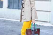 With neutral mini coat, yellow loafers and unique bag