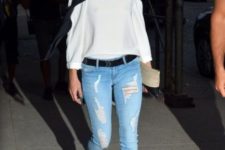 With off the shoulder blouse and distressed jeans