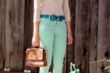 With pastel color shirt, brown bag and sandals