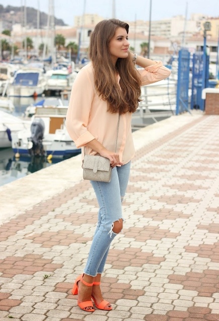 With peach blouse, jeans and mini bag