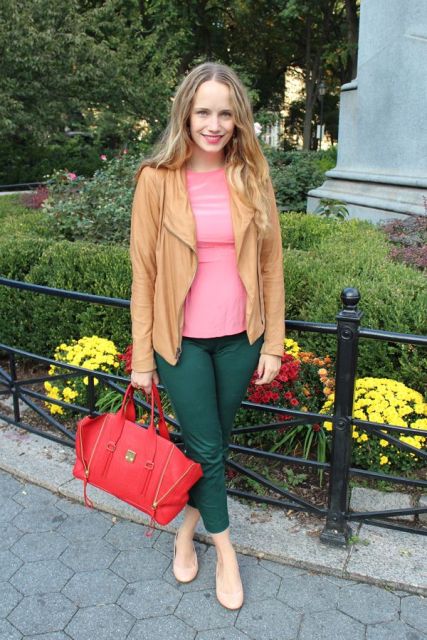 With pink shirt, light brown jacket and red bag