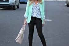 With polka dot blouse, black trousers, neutral shoes and bag