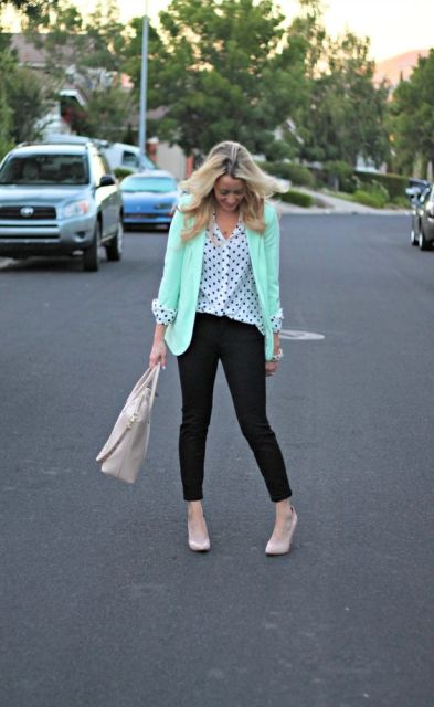 With polka dot blouse, black trousers, neutral shoes and bag