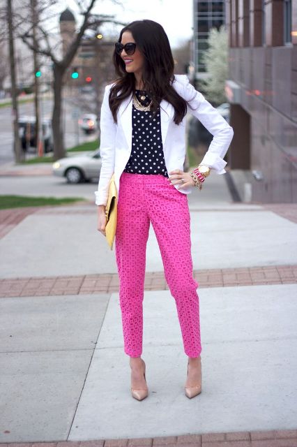 Fuchsia pants with polka dot shirt, white blazer and yellow clutch is an interesting alternative to monochrome office looks.