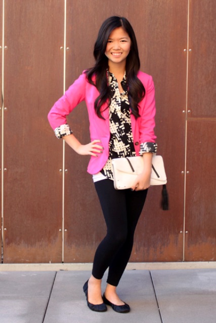 With printed shirt, black leggings, black flats and white clutch