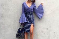 With purple bell sleeve blouse, striped skirt and bag