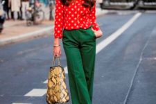 With red polka dot blouse, printed bag and black shoes