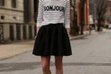 With striped shirt and black skater skirt