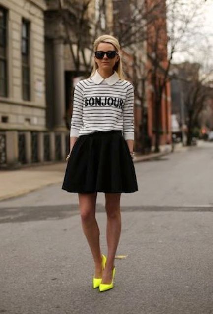 With striped shirt and black skater skirt