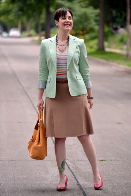 With striped shirt, camel skirt and red shoes