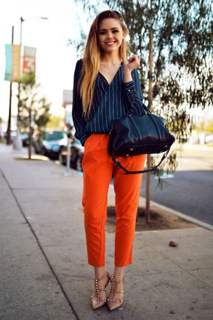 With striped shirt, heels and black bag