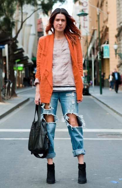 With sweatshirt, distressed jeans and ankle boots