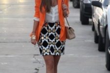 With white blouse, printed mini skirt and black shoes