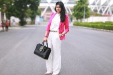 With white blouse, wide-leg pants and black bag