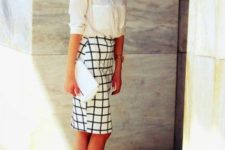 With white button down shirt, checked skirt and white clutch